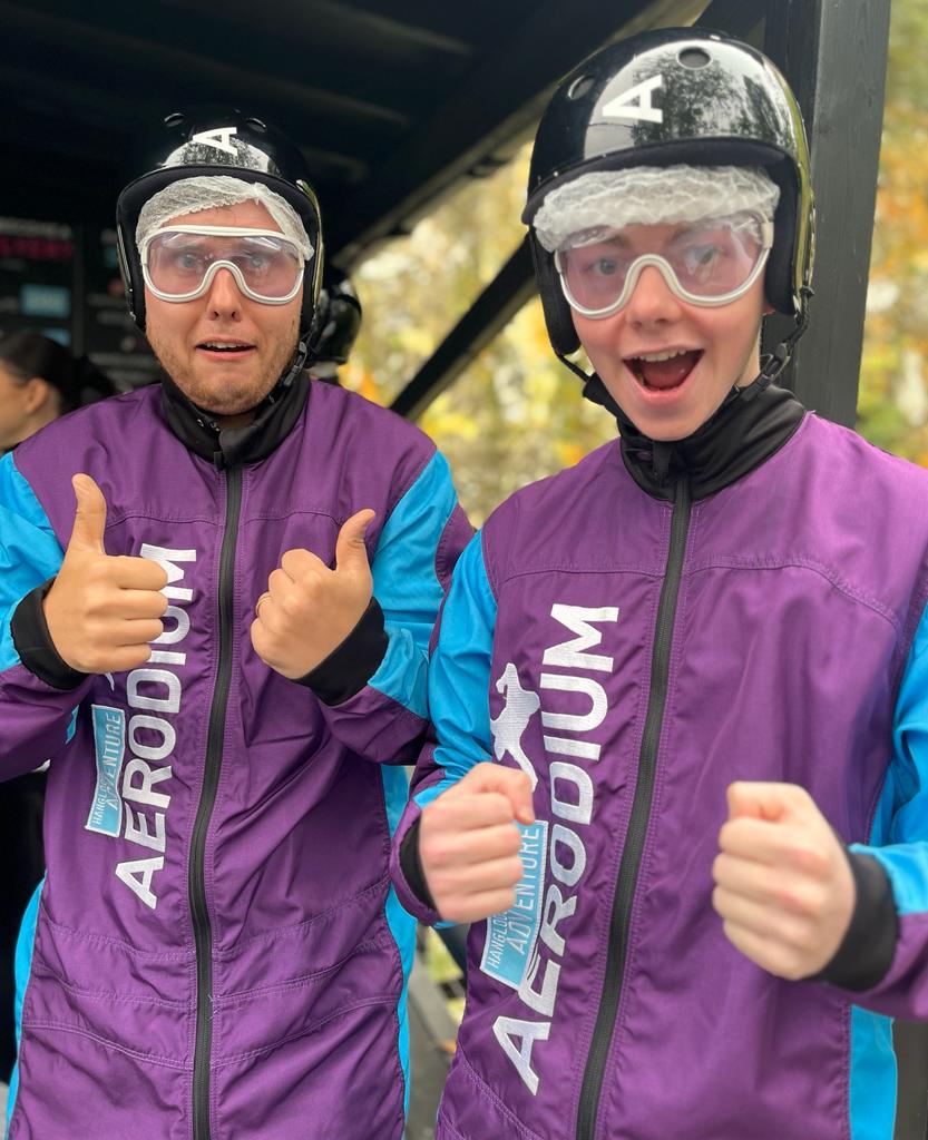 Enjoying Skydiving thumbs up